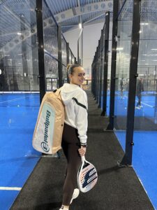 Padel With Holly walking between padel courts