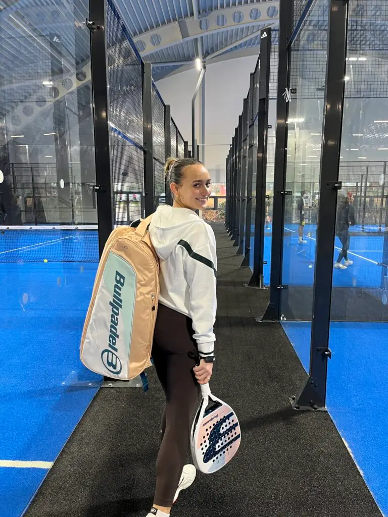 Padel With Holly walking between padel courts