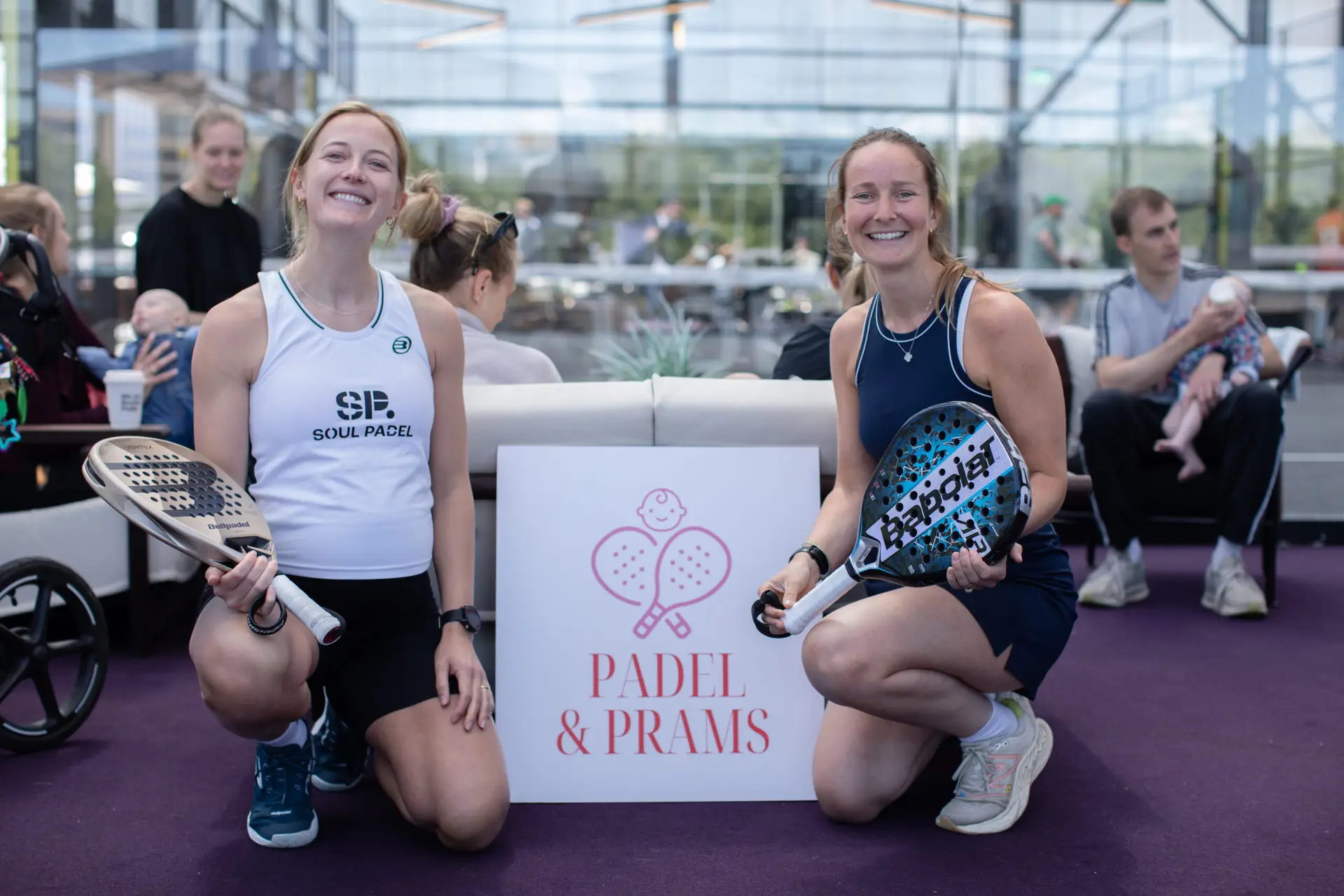 Padel & Pram Founders next to a padel court