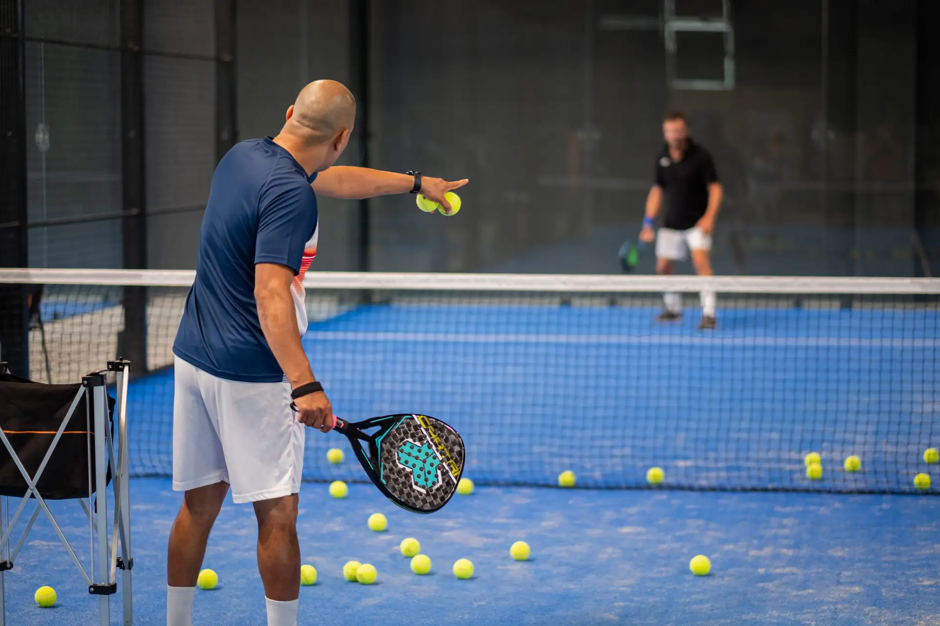Padel coach teaching on court