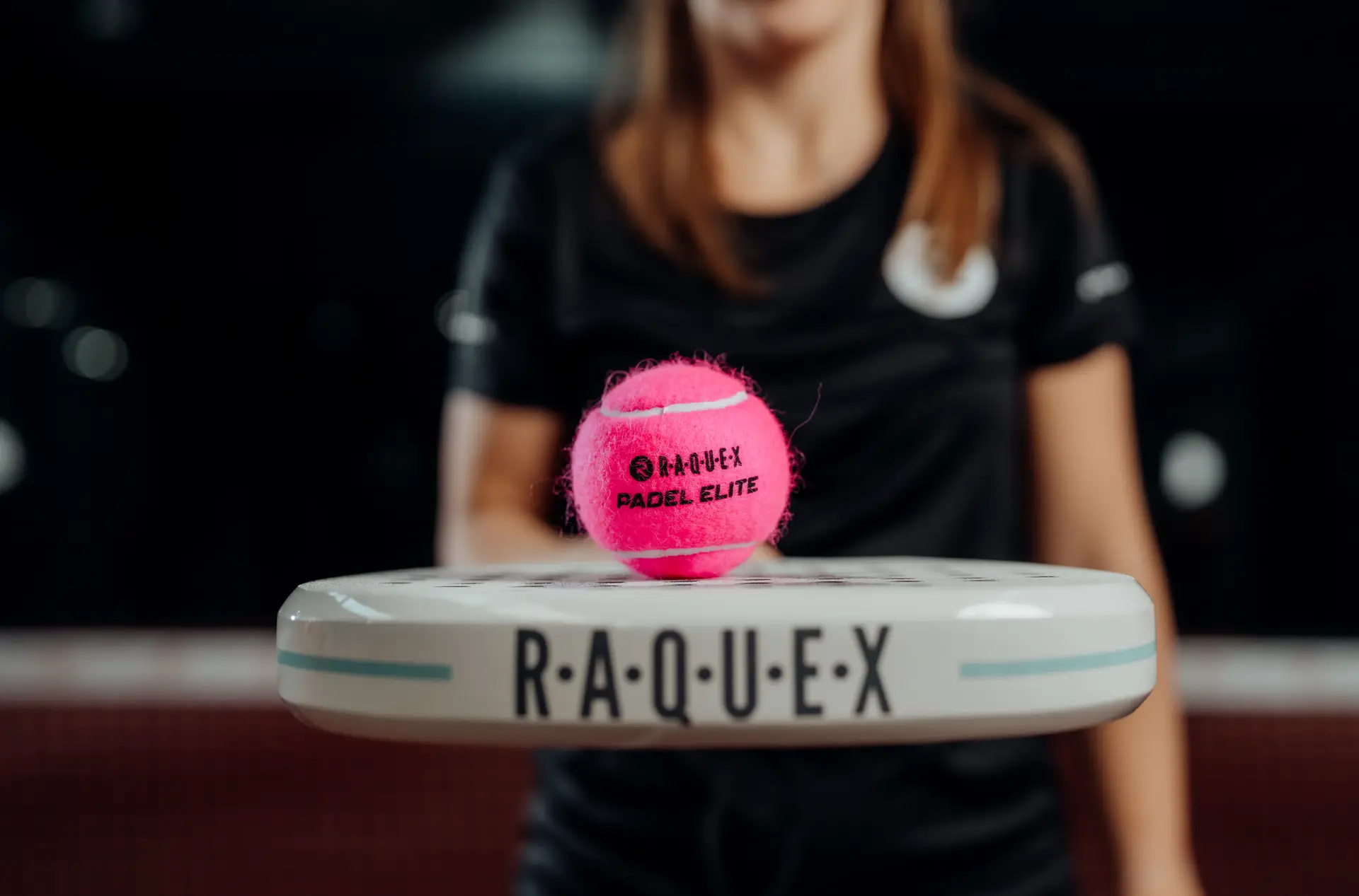 RAQUEX padel racket with ball on top