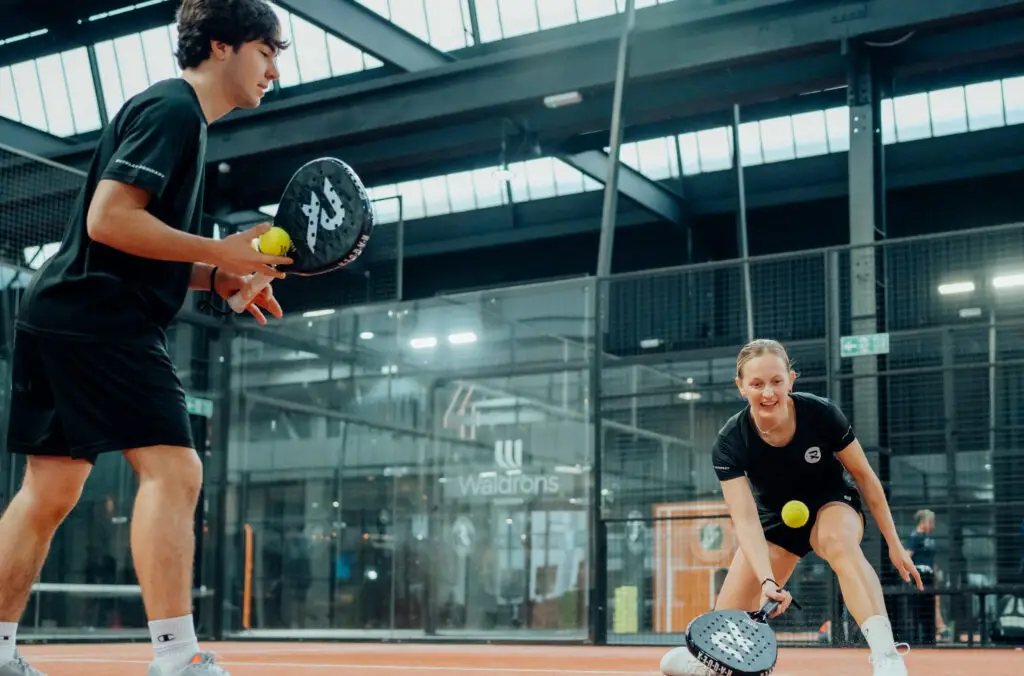 RAQUEX on padel court two players