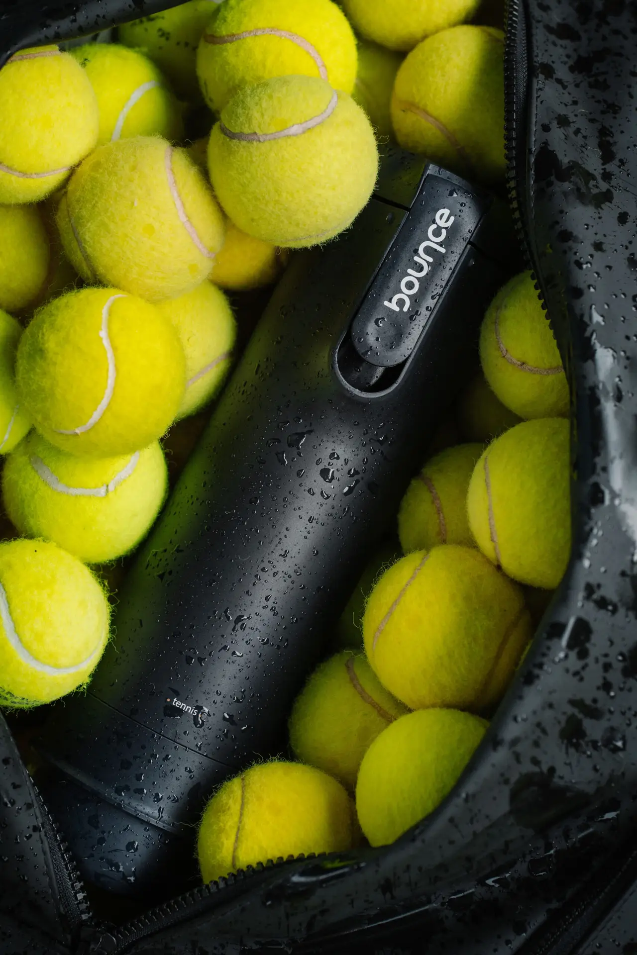 Bounce product surrounded by tennis balls