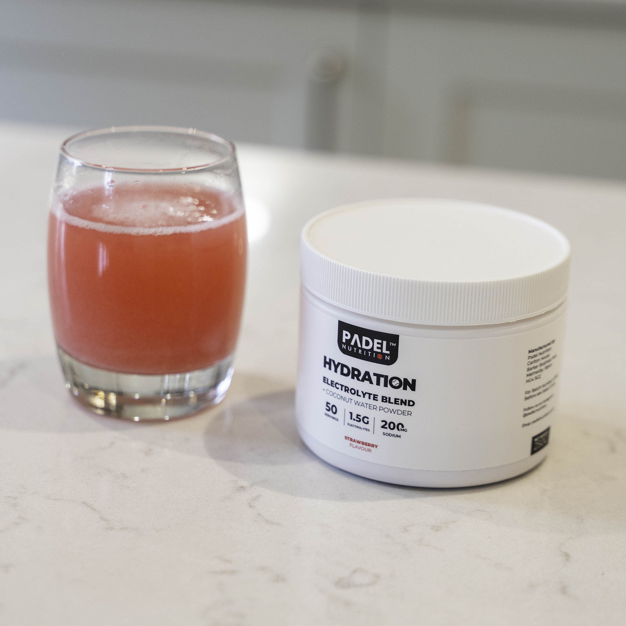 Glass with Orange/Red Liquid