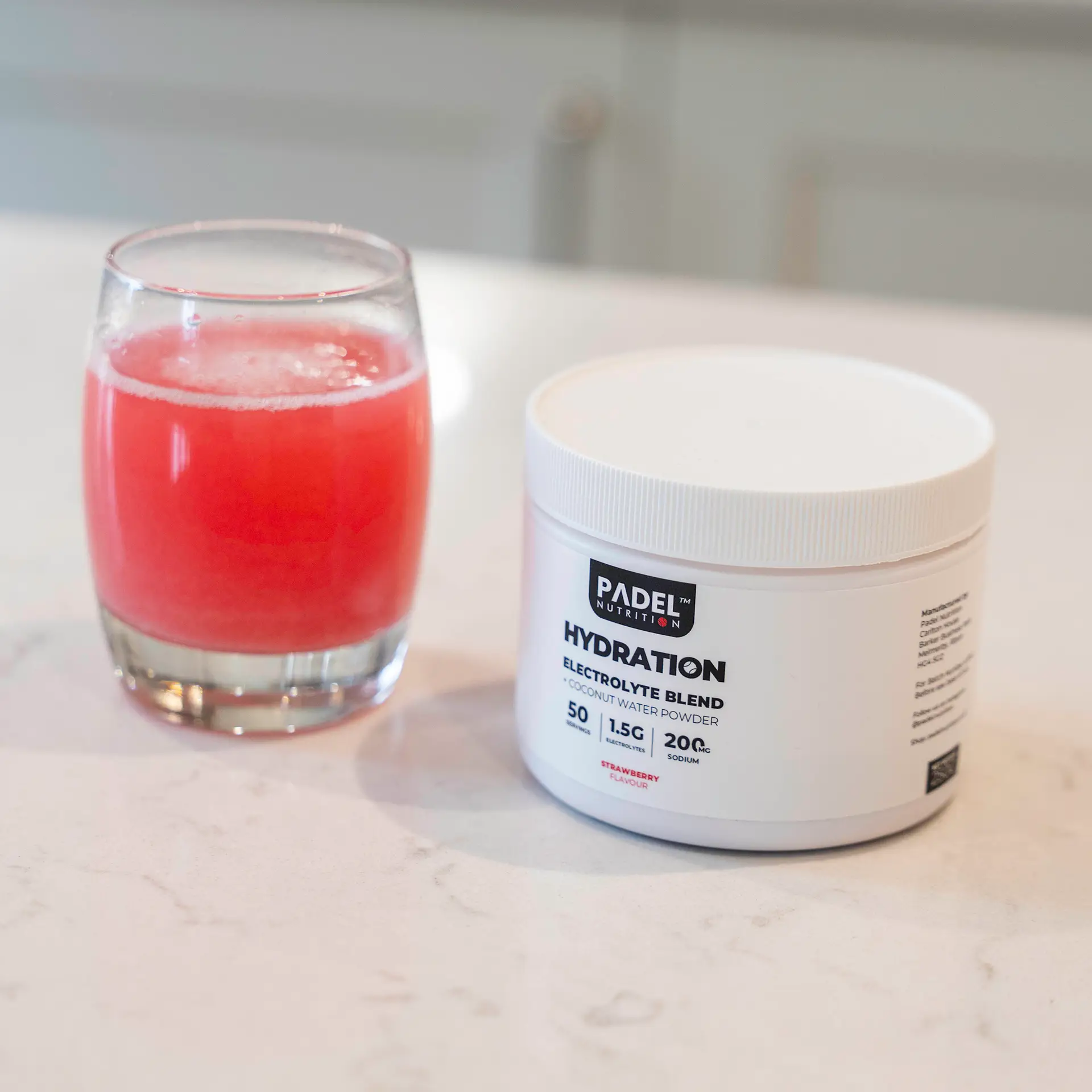 Glass with Orange/Red Liquid