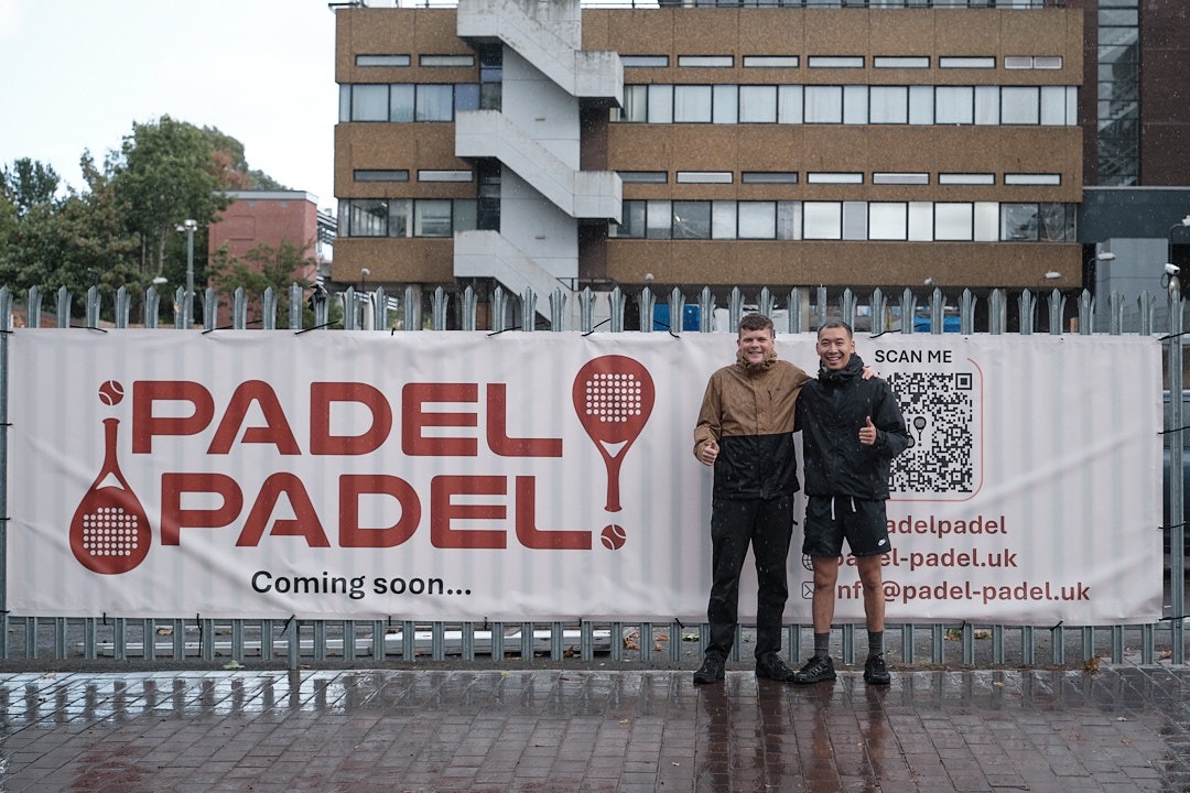 Padel Padel founders outside OOH banner
