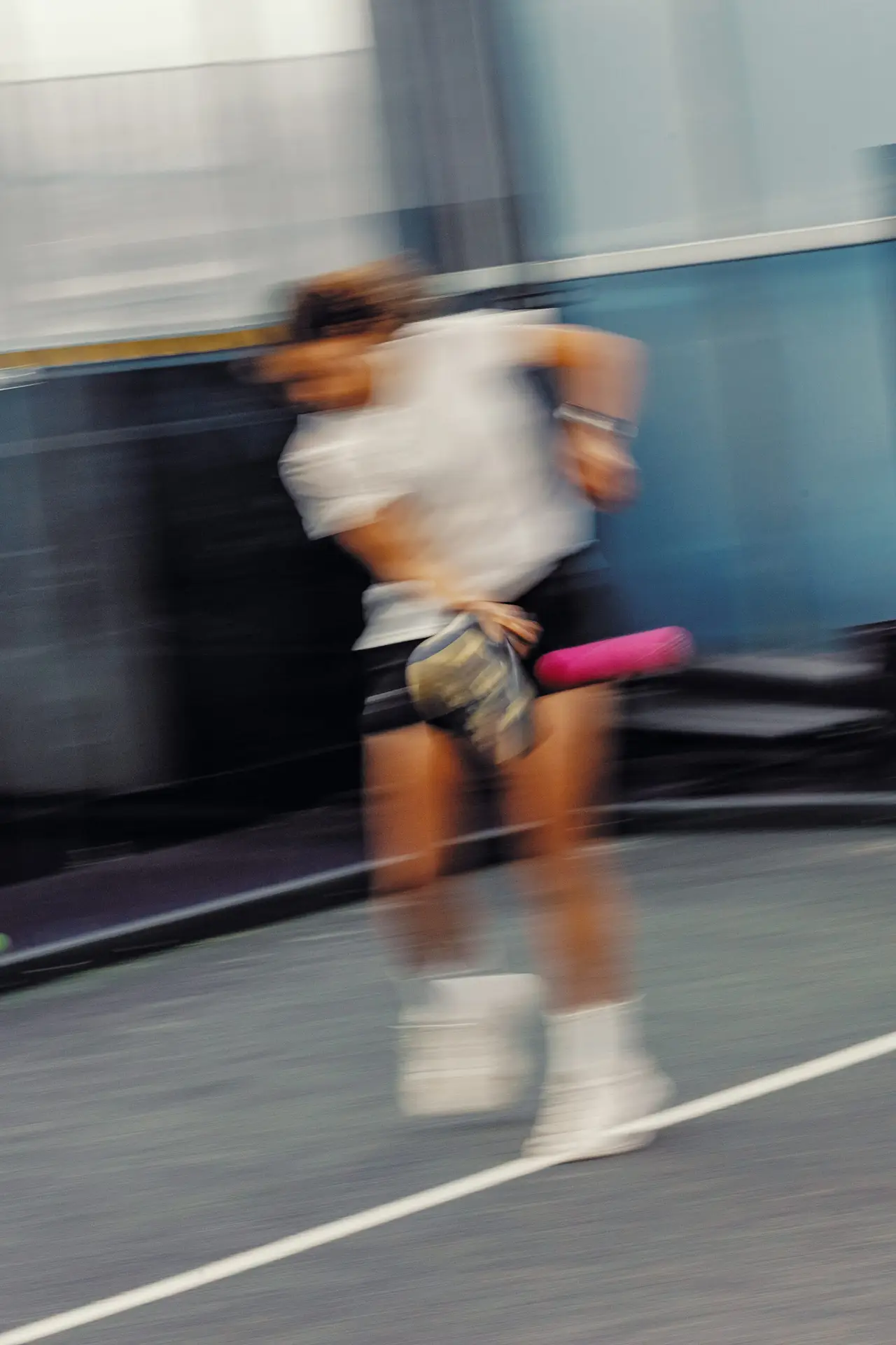 Y1 padel model hitting a padel shot