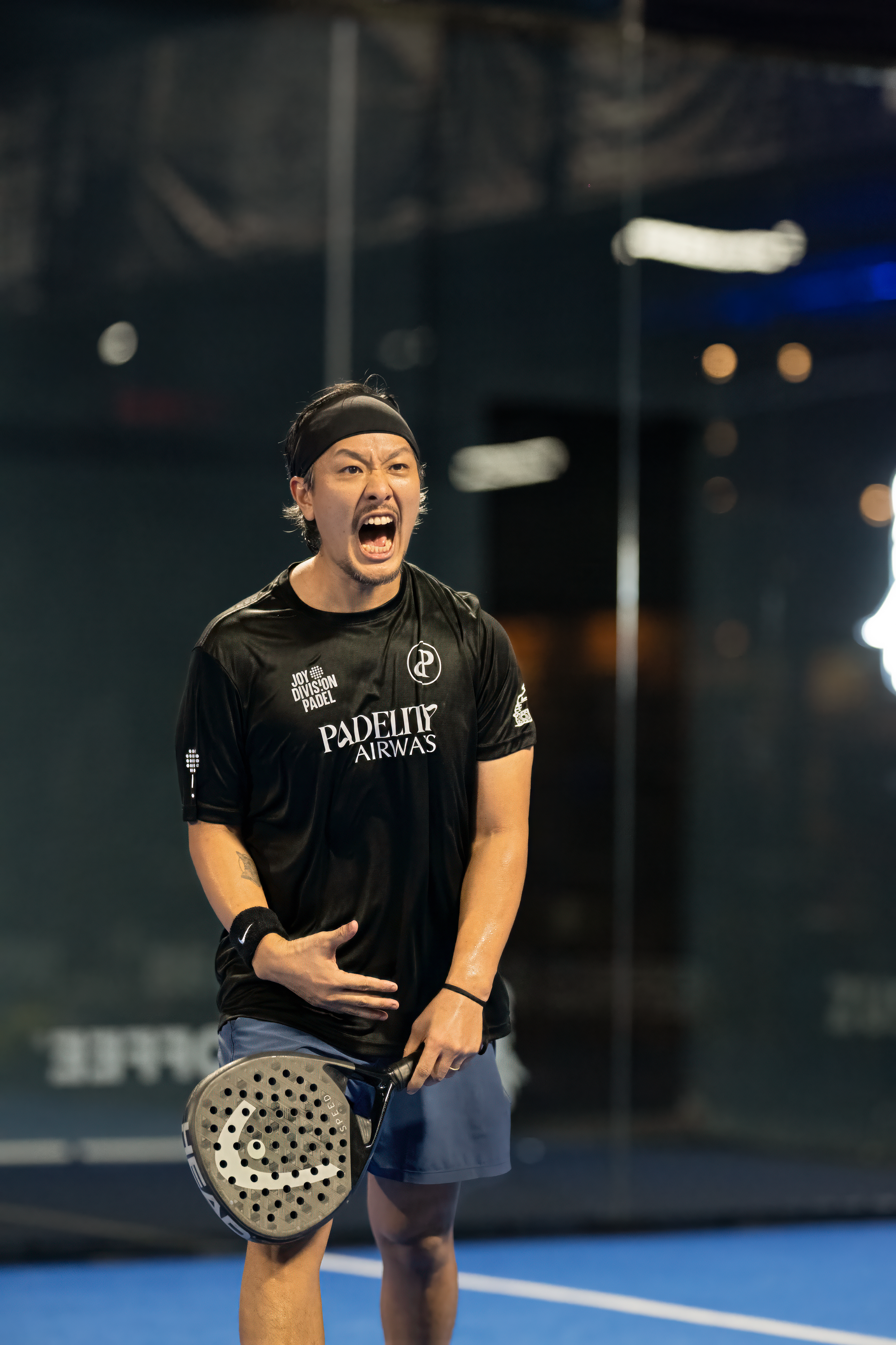Photograph taken by Rav of padel player who is animated on court