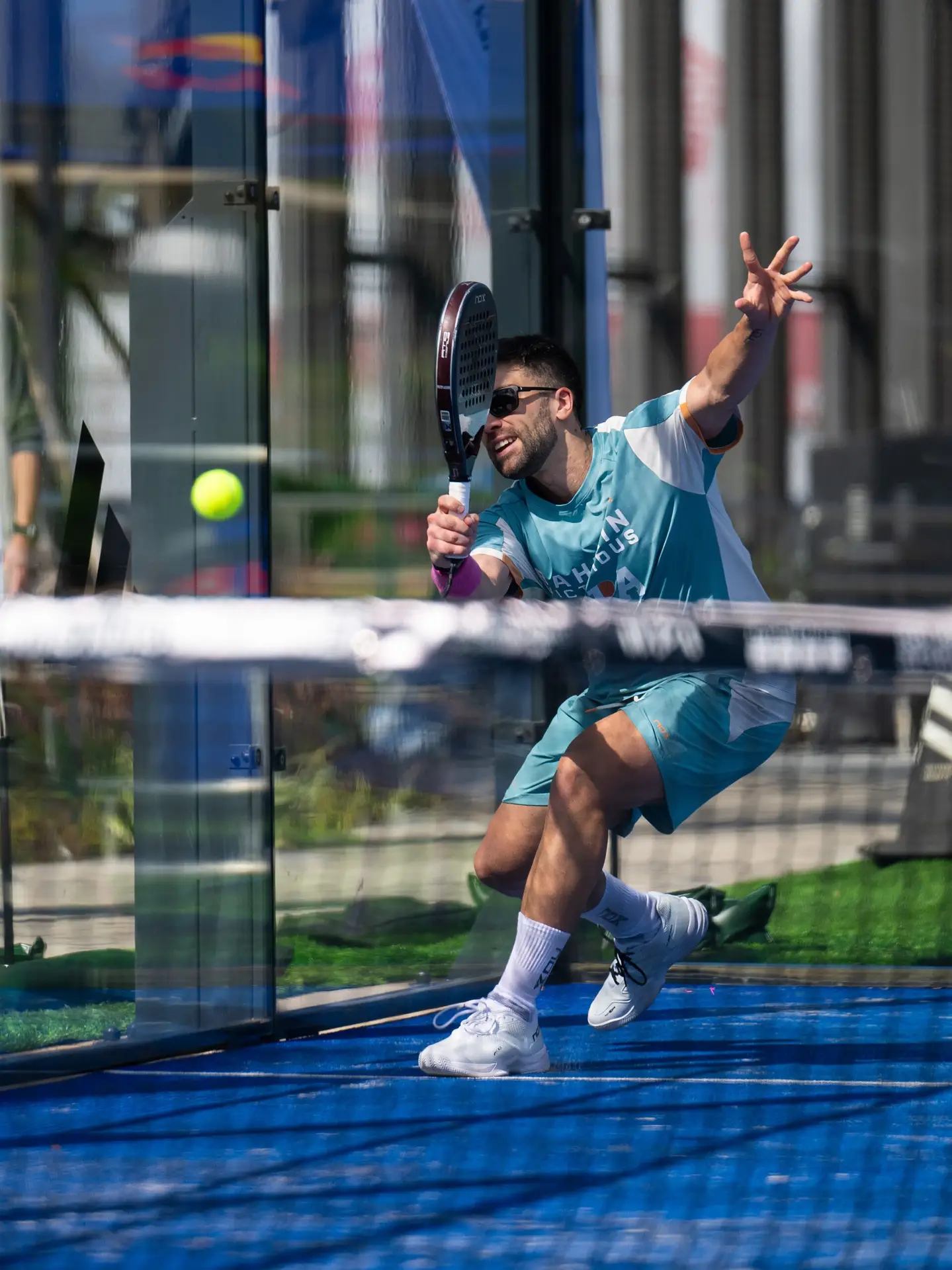 Photograph taken by Rav of padel player who is mid-swing