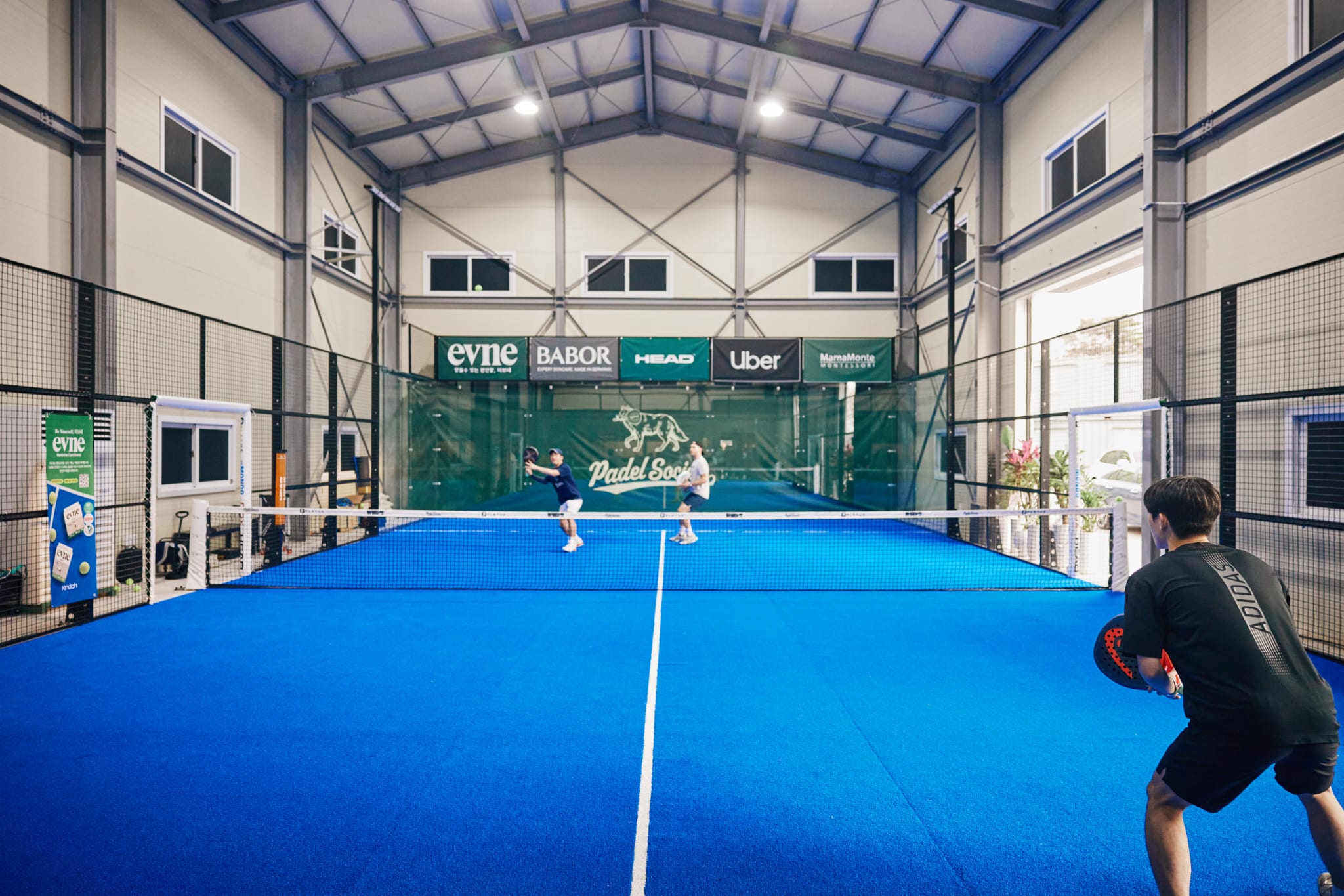Players on court at Padel Society, South Korea