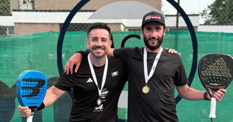 Jamie Guest and his doubles partner with tournament medals and padel rackets