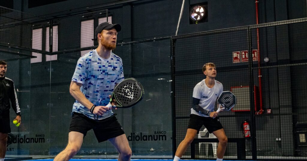 Louis Jarrold in the ready position during an indoor padel training session
